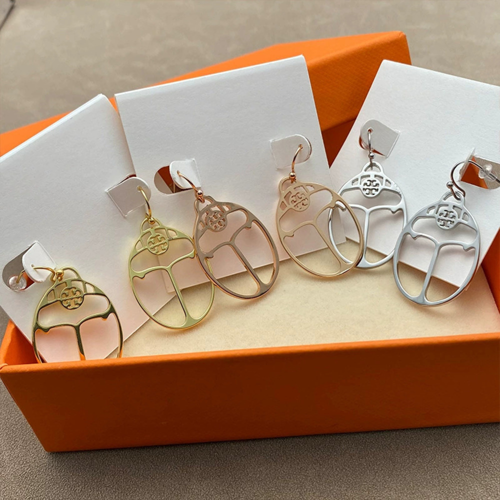 Tory Burch Hollow Oval Metal Earrings
